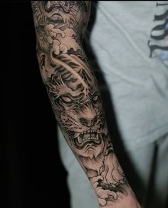 a man with a dragon tattoo on his arm