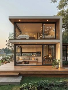 a modern house with large windows and wooden decking