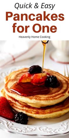 pancakes on a plate with syrup being drizzled over them