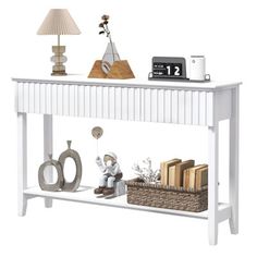 Our painted wood console table offers a sophisticated storage solution for your entryway. Its 3 spacious drawers keep essentials neatly organized, while the bottom shelf provides extra space for larger and taller items. Latitude Run® | Latitude Run® Entryway Console Table, 3 Drawer Sofa Table brownWood in White | 31.88" H X 51.18" W X 11.8" D | Wayfair Painted Entryway, Drawer Sofa, Behind Sofa Table, Sophisticated Storage, Sofa Table With Storage, Books Storage, Console Table Wood, Table Hallway, Shelf Modern