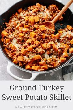 ground turkey sweet potato skillet in a pan with a wooden spoon on the side