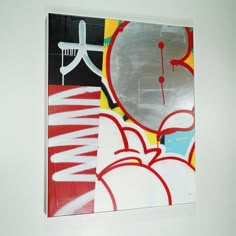 an abstract painting with white and red colors on the bottom half of it, in front of a white wall