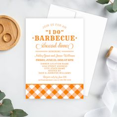 an orange and white gingham checkered pattern is on the front of this baby shower