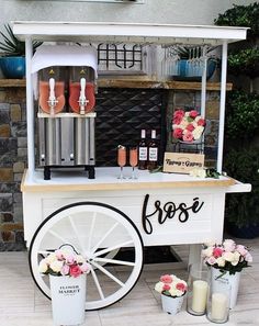 an ice cream cart is decorated with flowers and candles