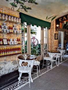 the inside of a restaurant with tables and chairs