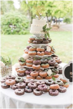 a wedding cake made out of doughnuts on a table