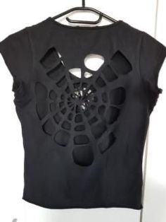 a black shirt with holes cut out on it