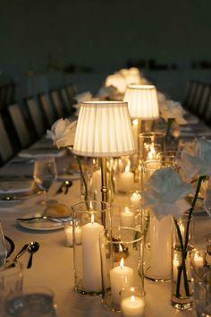 Wedding reception table with lamps and candles Lamps At Wedding, Table Lamp Wedding, Lamp Centerpiece Wedding, Candle Lit Wedding Reception Romantic, Flowerless Wedding Centerpieces, Candle Lit Wedding Reception, Candles Wedding Table, Candlelight Wedding Reception