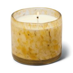 a marbled glass candle holder with a single lit candle in the middle, on a white background