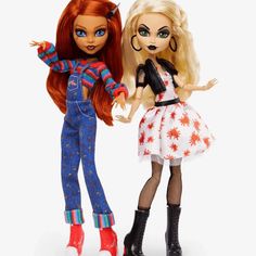 two dolls are standing next to each other