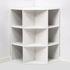 the corner shelf is white and has five shelves on each side, along with two doors