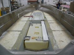 a boat is being built in a factory