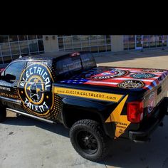 the truck is painted with different designs on it