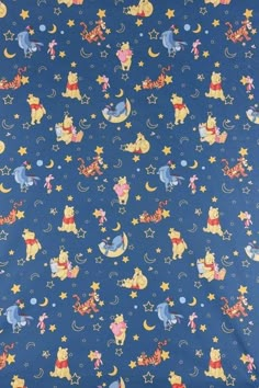 winnie the pooh stars and moon pattern on blue fabric with red, yellow, and blue colors