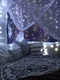 a bed that has some lights on it