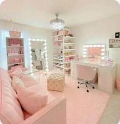 a bedroom with pink furniture and lights on the ceiling, in front of a large mirror