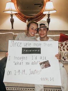 two girls holding up a sign that says, since we're more than friends