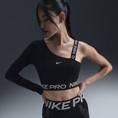 Push yourself feeling bold in this asymmetrical Nike Pro top. Lightweight and stretchy, the smooth fabric dries quickly to help you stay cool while reflective graphics brighten up your workout. Push Yourself, Confident Style, Workout Crop Top, Women Lifestyle, Nike Pros, Stay Cool, Cropped Top, Active Wear For Women, Nike Dri Fit