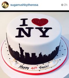 a cake with the words i love new york on it and a cityscape