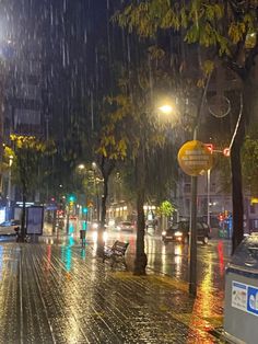 a city street at night in the rain