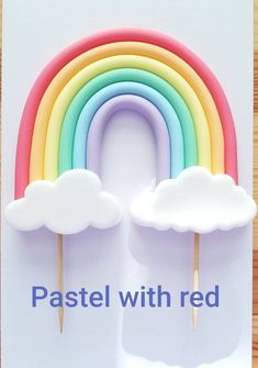 a card with a rainbow and clouds on it that says pastel with red