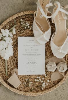 the wedding shoes are sitting on top of the basket