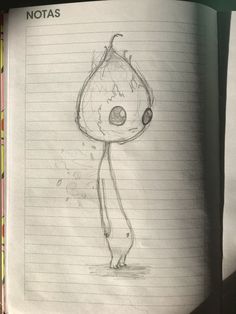 an open notebook with a drawing of a cartoon character