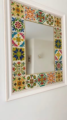 a mirror that is hanging on the wall