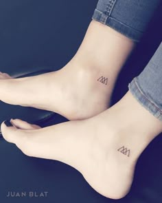 two people with small tattoos on their feet