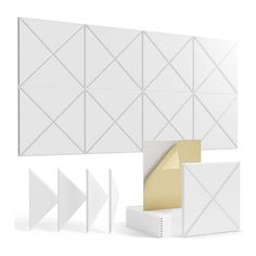 an assortment of white and gold wall panels with geometric designs on the sides, along with two