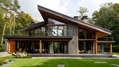 a modern house in the middle of a lush green yard