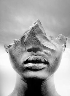 a black and white photo of a man's face on a pillow