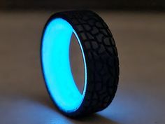 Gorgeous Blue Glow in the dark Unisex ring, perfect for men and women. Good for wedding, for special occasion and for everyday use. The ring is handcrafted using carbon fiber. High quality and gentle design. Beautiful piece of art that will draw attention and get compliments everywhere you wear it. Please note, You can choose the size of the ring . The width is 8 MM The ring will always arrive in a nice gift box ready to open or give away. Custom orders are always welcomed. If You love it, pleas Carbon Fiber Rings For Men, Mens Wedding Bands Carbon Fiber, Tire Tread Ring, Glow In The Dark Mens Ring, Carbon Fiber Wedding Band, Tire Rings, Fordite Ring, Black Band Ring, Fordite Jewelry