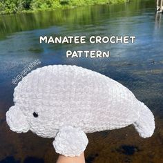 a crocheted stuffed animal that looks like a manateee in the water