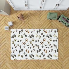 an overhead view of a dog paw print area rug