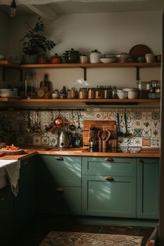 a kitchen filled with lots of pots and pans on top of wooden shelves next to a sink