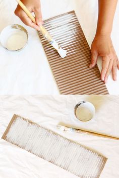 someone is painting on the table with white paint