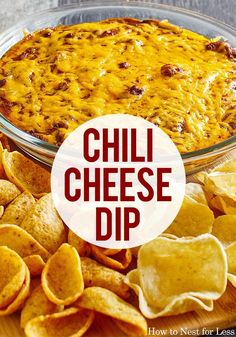 a cheesy dip in a glass dish with tortilla chips on the side