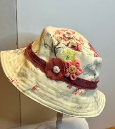 this bucket hat is great for your summer outfit, or going out to that festival.   Keep the sun off in style.   Hat measures 22- 24 inches.   Embellished with velvet ribbon and fabric flowers Bohemian Adjustable Sun Hat For Garden Party, Adjustable Bohemian Sun Hat For Garden Party, Adjustable Bucket Sun Hat For Spring, Spring Adjustable Bucket Sun Hat, Bohemian Bucket Hat For Garden Party, Adjustable Brimmed Bohemian Cloche Hat, Whimsical Adjustable Sun Hat For Summer, Handmade Whimsical Sun Hat For Summer, Whimsical Adjustable Summer Hats