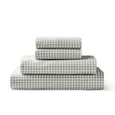 three sheets in grey and white gingham checkered pattern on top of each other