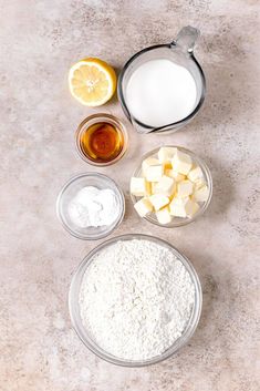 the ingredients to make this dish include butter, sugar, and lemons on a table