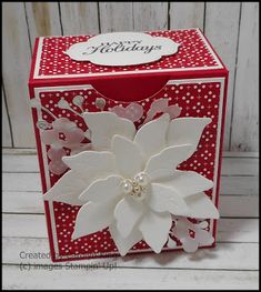 a red box with white flowers on it