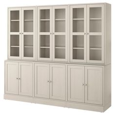 a white bookcase with glass doors on the top and bottom shelves, against a white background