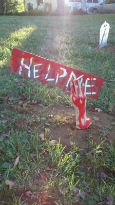 a hand holding up a sign that says help