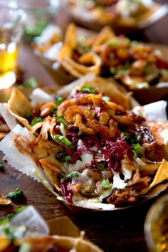 some tacos are sitting on a table and ready to be eaten