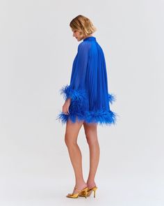 The Pleated Feather Trim Mini Dress was part of the Spring 2023 Runway Collection. This A-line dress features hand-dyed genuine Ostrich feather trimmed sleeves and hem, and a back button closure. Incorporating pleats, this mini dress is fully lined. Made in Brazil. VEC24295US Spring 2023 Runway, Ostrich Feather Trim, Feather Trim, Ostrich Feather, Ostrich Feathers, Runway Collection, Spring 2023, Made In Brazil, Hand Dyeing