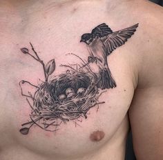 a bird sitting on top of a nest in the middle of a man's chest