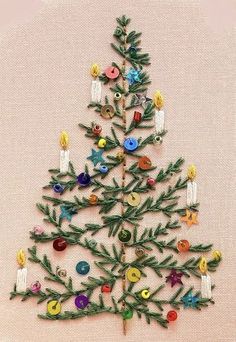 a cross stitch christmas tree with buttons on it