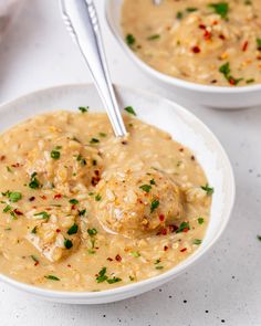 two bowls of soup with meatballs and garnishes on the top one