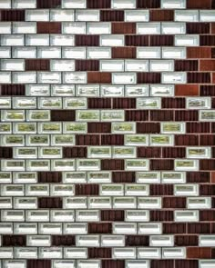 a close up view of a brick wall with lots of glass blocks on it's side